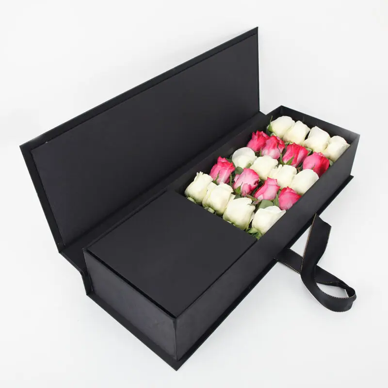 01 Close-up view of the arrangement of 8 deep purple and 12 white roses in a sleek black box.