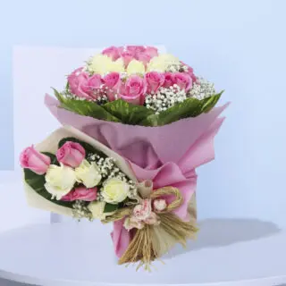 Duo of a similar big and small bouquets of pink and white roses for new moms.