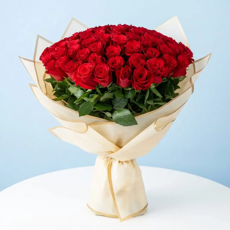 100-Red-Roses-Bouquet A 100 red roses bouquet wrapped in half white wrap.