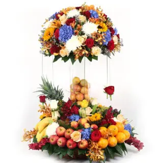 A traditional basket arrangement of 9 fresh fruits and vibrant flowers featuring apples, grapes, pineapples, kiwi, orange, banana and more.