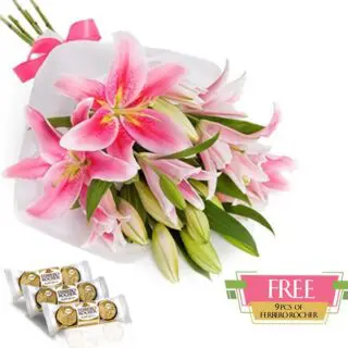 Hand bouquet of pink lilies tied with a pink ribbon, with 9 FREE Ferrero Rocher chocolates.