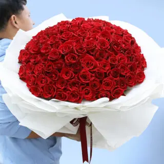 A large bouquet of vibrant red roses, symbolizing love and desire, available in 100, 200, and 300-stem options.