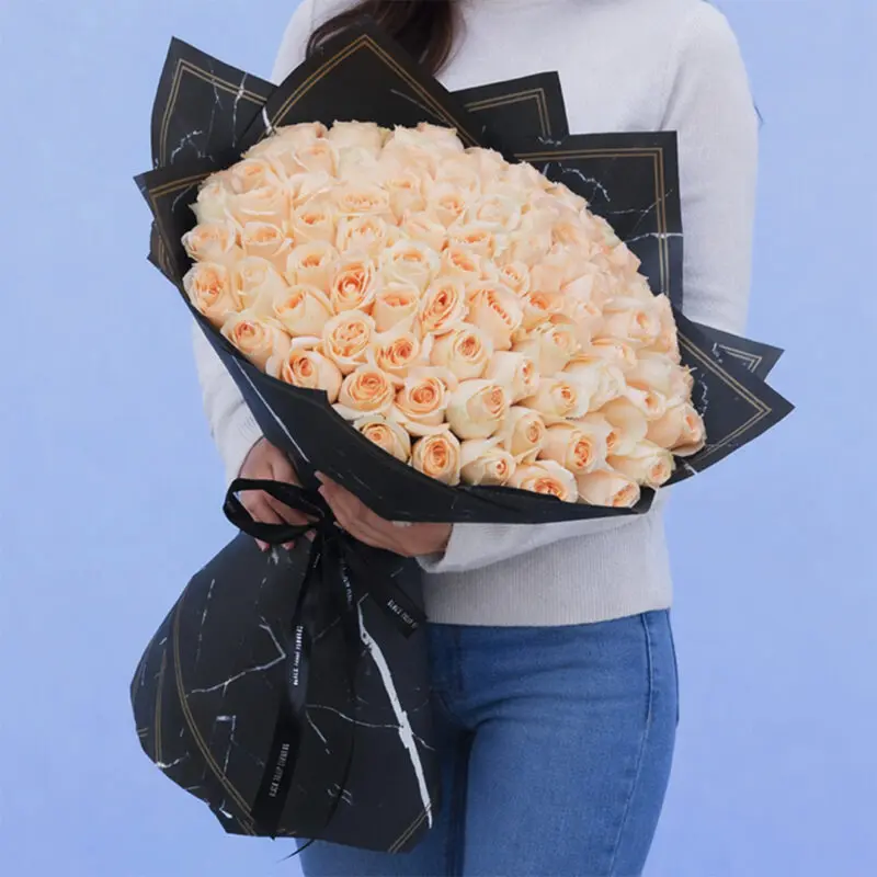 perfect-peach-rose-bouquet-2026 A bouquet of 85-90 delicate peach roses, radiating warmth and charm, ideal for expressing gratitude and friendship.