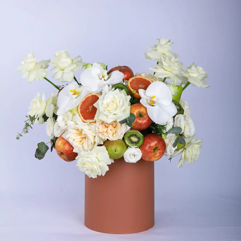 Peaceful Fruit (3) Peaceful Fruit Arrangement composed of mix fruits and flowers in a box by Black Tulip Flowers.