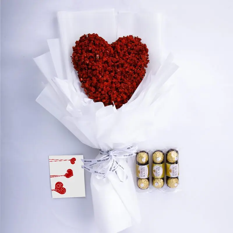 Pure Heart Surprise (1) Red heart-shaped gypsophila bouquet, Ferrero chocolates, and a message card in a white wrap tied with a white ribbon.