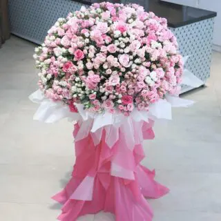 Zoomed-in view of a lavish bouquet of 100 baby roses and 200 pink roses, beautifully wrapped.