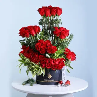 Luxurious 70-Stem Red Roses Centerpiece with Beautiful Green Leaves – Ideal for Romantic and Formal Celebrations