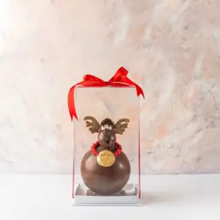 A charming 3D reindeer crafted from Belgian chocolate, ideal for adding a delightful touch to Christmas festivities.