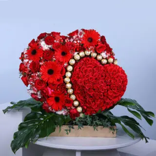 Baby roses, red gerberas, and Rocher Ferrero heart-shaped floral