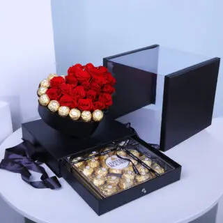 Valentines Day Home 62 Red roses and Ferrero chocolates arranged in a heart-shaped black box, with an extra Ferrero box.