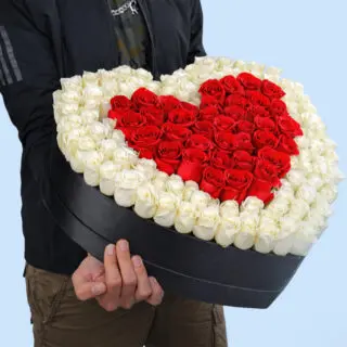 Heart-shaped floral arrangement symbolizing love and purity for Valentine’s Day
