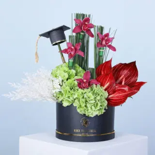 Graduation flower gift with hydrangeas, anthuriums, 4 cymbidium, and steel grass