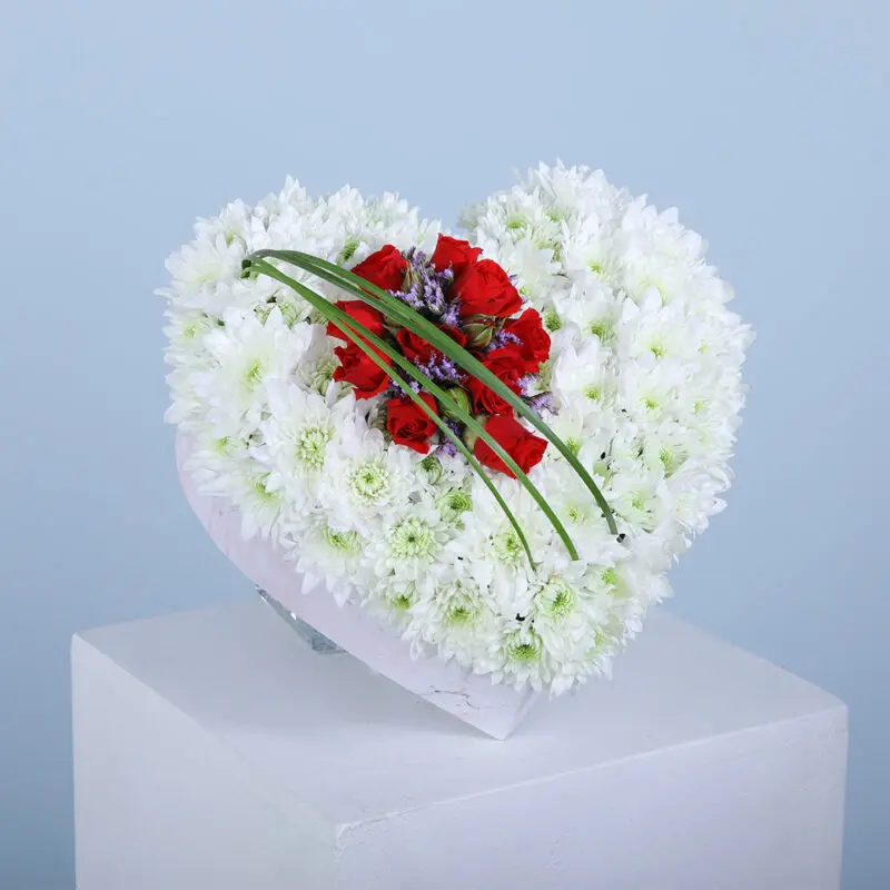 01 10 white chrysanthemum stems and 2 red baby roses elegantly arranged in a heart-shaped box.