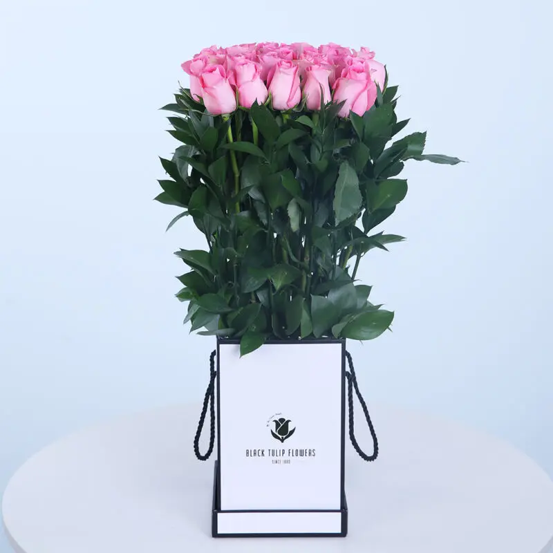 Stylish Box of Pink Roses Pink rose bunch featuring fresh and vibrant pink roses, ideal for expressing love and gratitude.