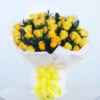30 vibrant yellow roses with lush green leaves in a bouquet