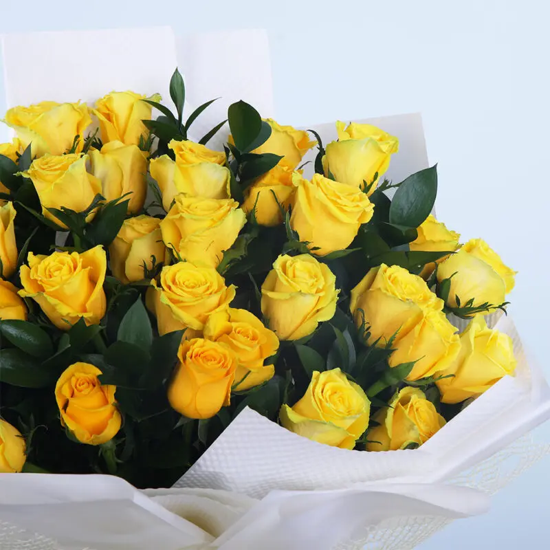 02 - Golden Glow Roses Bright yellow roses bouquet with fresh green leaves
