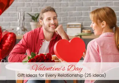 A girl, holding a gift card in her hand, her boy sitting next to her in a hotel decorated with Valentine's Day balloons and flowers.