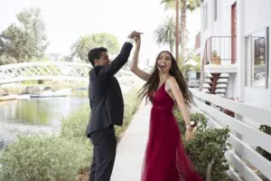 Engaged couple holding hands