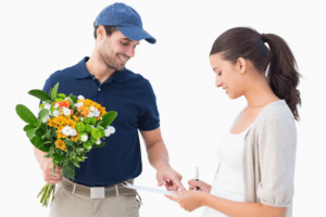 A bouquet of vibrant flowers, a symbol of love and admiration delivered to a girl