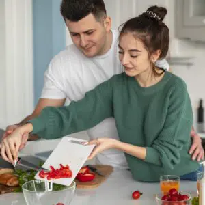 young couple cooking together at home