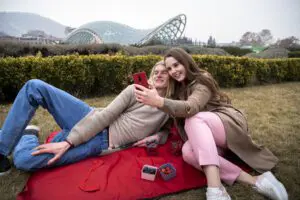 Gen Z young couple taking selfies