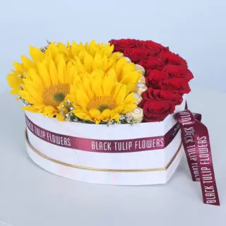 Heart-shaped box with sunflowers, roses, and Ferrero Rocher chocolates