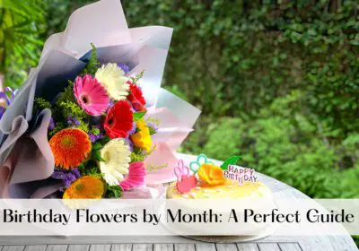 A colorful bouquet of flowers and a birthday cake on a table outdoors.