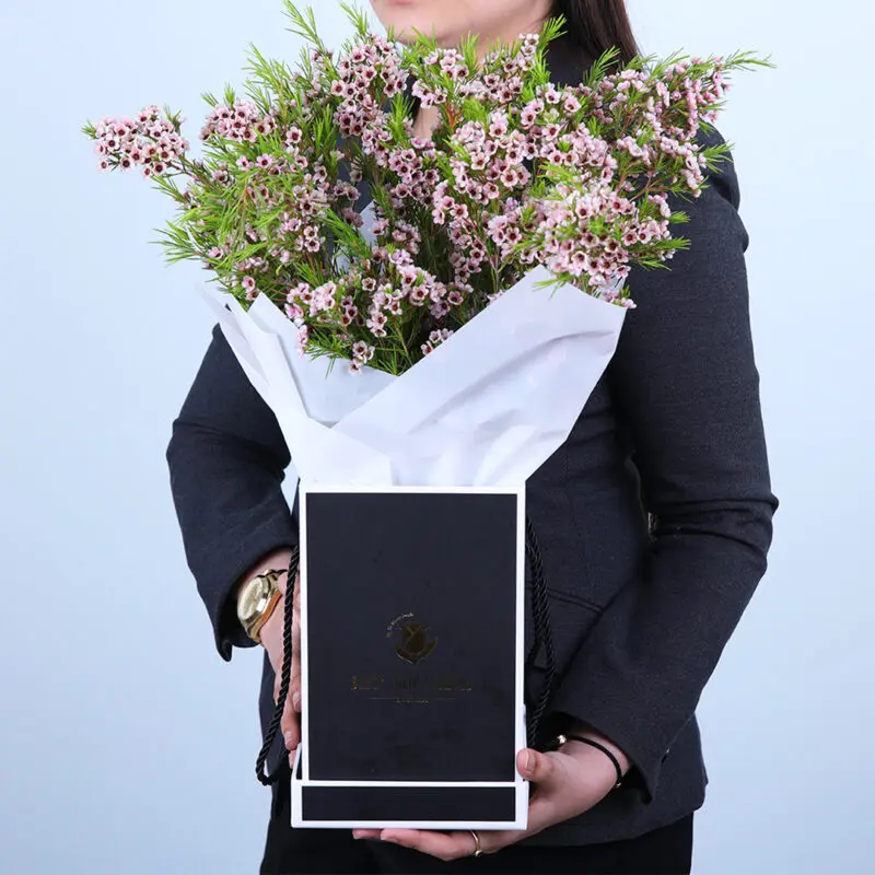 fluttering-bunch-of-bloom-2026 Vibrant Wax Flower Arrangement in Pastel Shades
