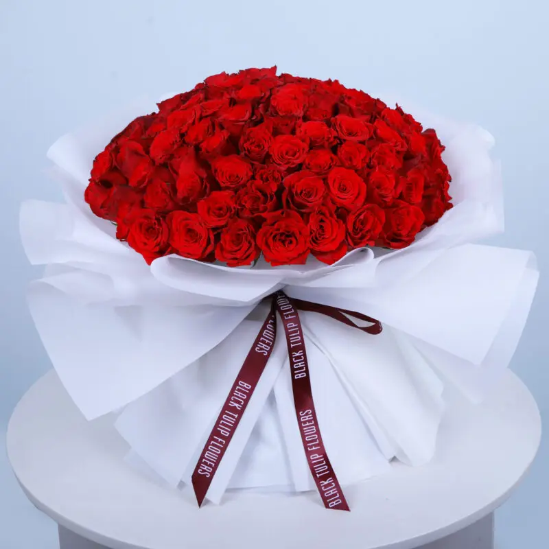 101 red roses-valentine bouquet Bouquet of 101 red roses tied elegantly arranged in white wrap and tied with maroon ribbon.
