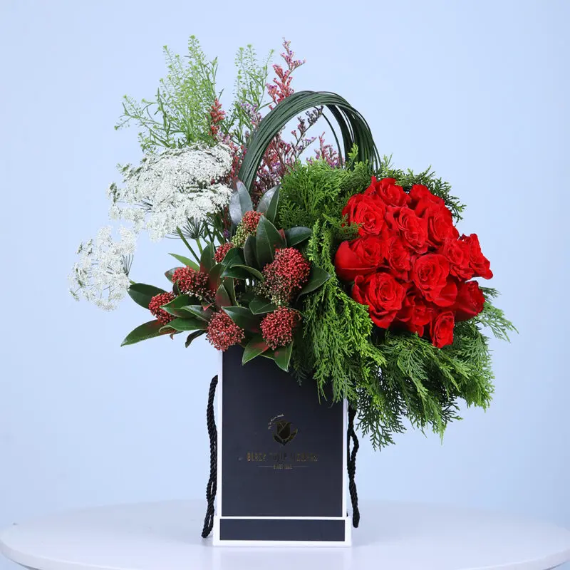 Valentine-Cheer-Floral-Box Valentine flower box overflowing with red roses, evergreens, and white blooms, perfect for spreading love