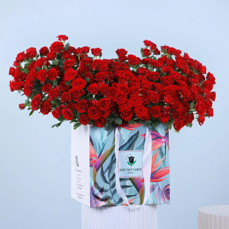 red-roses-carry-bag Red roses beautifully arranged in an easy-to-carry bag.