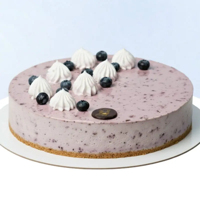 blueberry-cheesecake-1kg Blueberry Cheesecake 1Kg by Mister Baker topped with blueberries and cream.