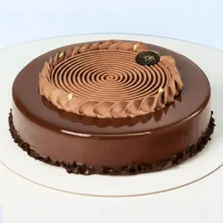 Chocolate Mousse Cake 1 Kg by Mister Baker with creamy mousse layers and glossy chocolate finish.