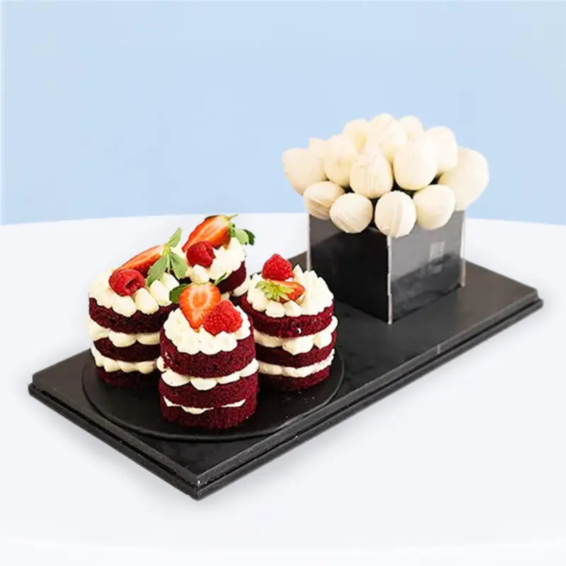 red-velvet-cake-strawberry-gift-box_01 Clear Lucite box with mini red velvet cakes topped with strawberries and white chocolate-coated strawberries, tied with black ribbon.
