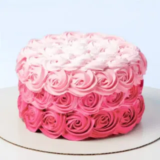 Rose Swirl Cake 1 Kg by Mister Baker with pink rose frosting and layered design