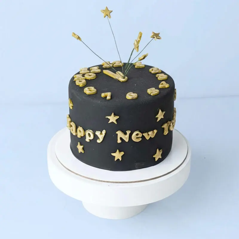 new-year-black-gold-clock-theme-cake A 1kg black fondant clock theme New Year cake with gold stars and clock hands in a sleek minimalist finish, finished with a “Happy New Year” message.