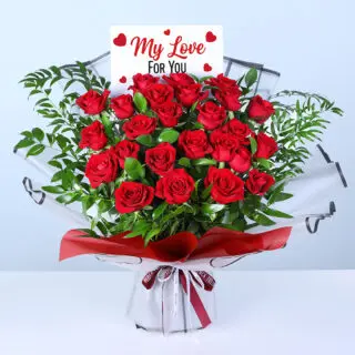 Valentines Day Home 26 25 red roses and lush greenery in red wrapping, finished with a message card.
