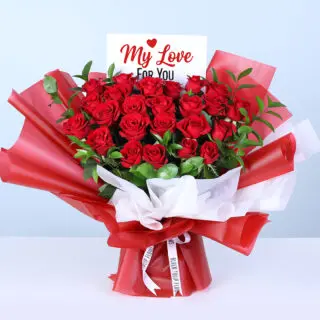 Valentines Day Home 24 25 red roses and lush greenery in red wrapping, finished with a message card.