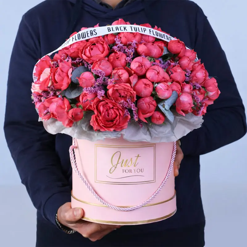 Bombastic pink rose peony blooms and pink casbia in a pink bloom box.