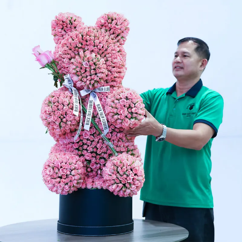light-pink-spray-rose-teddy-box Light pink spray roses in a teddy arrangement style, finished with a white ribbon.