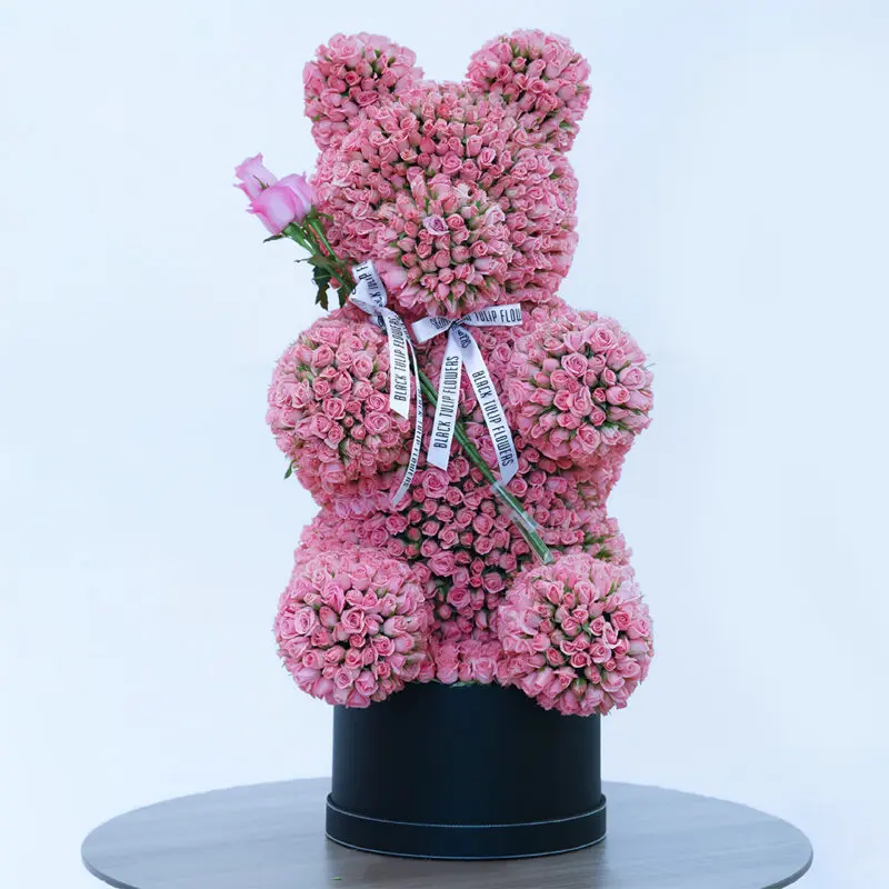 light-pink-spray-rose-teddy-box_02 Light pink spray roses in a teddy arrangement style, finished with a white ribbon.