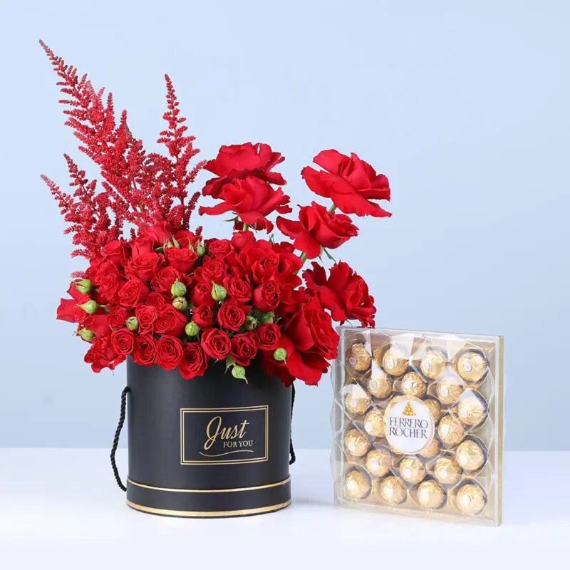 luxury-red-roses-box-premium-chocolates Red roses in a black luxury box, with a premium Ferrero Rocher chocolate box.