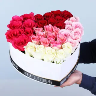 Valentines Day Home 54 A heart-shaped box featuring red roses, pink roses and white roses.