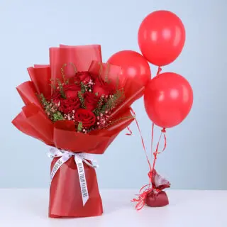 Bouquet of red roses with baby’s breath and green fillers in red wrapping, with three red balloons.