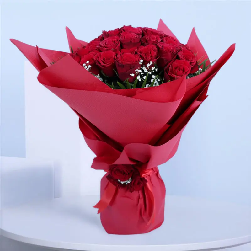 red-roses-gypso-bouquet-01 30 red roses with gypsophila and palm leaves in red wrap tied with a red ribbon.