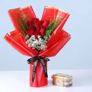 25 red roses bouquet with white filler flowers and green foliage in pink wrapping, with a mini Ferrero chocolate pack.