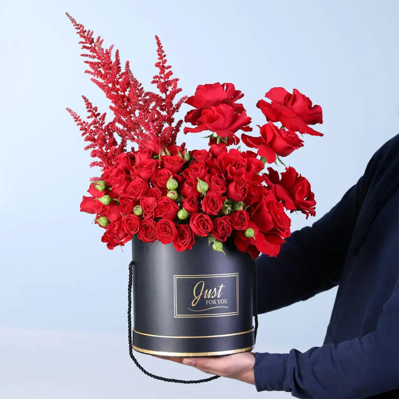 red-roses-valentine-box-gift A black box with red roses, red spray roses, and red astilbe accents.