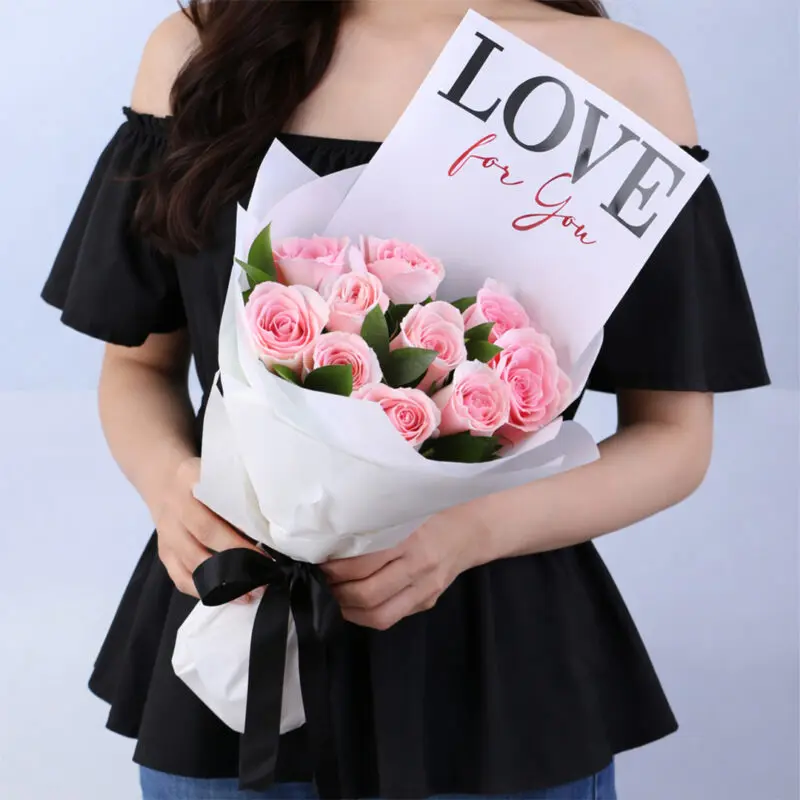 pink-roses-love-card-bouquet-valentines Pink roses and greenery in elegant white wrapping, finished with a "LOVE For You" message card.
