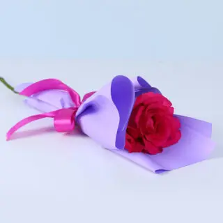 Single long-stem dark pink rose bouquet in stylish wrapping, perfect for heartfelt and memorable gestures