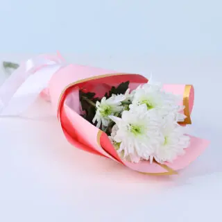 Beautifully wrapped single white chrysanthemum bouquet for sympathy and elegant gifting